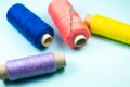 Colorful spools of thread with a needle, close up Royalty Free Stock Photo