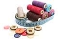 Colorful spools of thread, tape measure and colored buttons Royalty Free Stock Photo