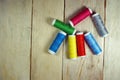 Colorful spools of thread on wooden table Royalty Free Stock Photo