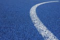 Colorful sports court background. Light blue field rubber ground with curved white line outdoors. Top view