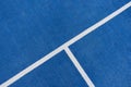 Colorful sports court background. Top view to blue field rubber ground with white line outdoors Royalty Free Stock Photo