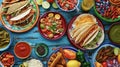 A colorful spread of traditional Mexican street foods from tacos to churros entices hungry picnicgoers Royalty Free Stock Photo