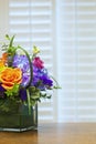 Colorful Spring Flowers in Square Vase on Kitchen Counter Royalty Free Stock Photo
