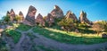 Colorful spring panorama of Cappadocia. Early morning scene of Uchisar Castle. Sunrise in famous Uchisar village, district of