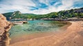 Colorful spring panorama on the cozy beach in northeastern Corinthia, Greece. Sunny outdoor scene of the Greek resort. Beauty of n