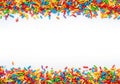 Colorful sprinkles border on white background Royalty Free Stock Photo