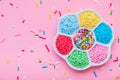 sprinkles in plate over pink background, for decoration cake and bakery, copy space