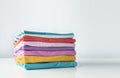 Colorful stack of cotton clothes on white empty space background Royalty Free Stock Photo