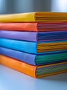 Colorful stack of folders neatly organized on a desk. Royalty Free Stock Photo