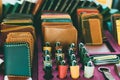 Colorful stack of leather lighters and wallets