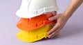 Stacked Safety Helmets in Bright Colors for Construction Workers and Site Security Royalty Free Stock Photo