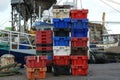 Colorful stacks of fish boxes in the harbor. Port of Wicklow in Ireland Royalty Free Stock Photo