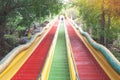 Colorful stairs going up to top floor of Thum Sua Temple or Tiger Cave Temple, Kanjanaburi Provine.