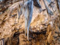 Colorful stalactites in the cave Royalty Free Stock Photo