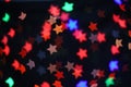 Colorful Star bokeh blurred abstract background. Christmas and new year party concept. Royalty Free Stock Photo
