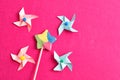 A colorful star shape lollipop with colorful pinwheels on a pink background Royalty Free Stock Photo