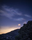 Colorful Stars Appear at Dusk Over a Valley