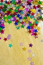 Colorful stars on gold background, portrait