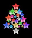 Colorful stars in shape of Christmas tree black background isolated close up, decorative New Year fir made of shiny stars Royalty Free Stock Photo