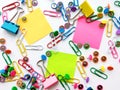 School and office supplies paper clips, pins, notes, stickers on white background Royalty Free Stock Photo