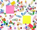 School and office supplies paper clips, pins, yellow notes, stickers on white background Royalty Free Stock Photo