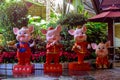 Colorful statues of four little pigs on the street of Sanya at cloudy day