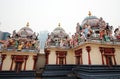 Colorful statues placed over the roof of Sri Mariamman Temple, the oldest hindu temple in Singapore Royalty Free Stock Photo