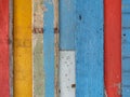 Colorful step wooden wall surface painted with red, yellow, blue, and brown color in vintage and retro style Royalty Free Stock Photo