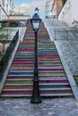 Colorful steps from a street in Montmartre leading up to the Basilica of the Sacred Heart of Paris. Royalty Free Stock Photo