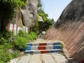 Stone steps between granite rocks to go to the top of the mountain Royalty Free Stock Photo