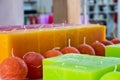 candles arranged in shelves and sorted by color in a candle shop Royalty Free Stock Photo