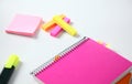 Colorful sticky bookmarks for Notebook, staplers and pen on white background. Selective focus. Royalty Free Stock Photo