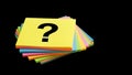 Colorful sticky note with question mark on black background Royalty Free Stock Photo