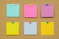 Colorful sticky notes on cork bulletin board Royalty Free Stock Photo