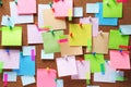 Colorful sticky notes on cork bulletin board Royalty Free Stock Photo