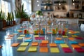 colorful sticky notes and small cubes organized in glass jars on a reflective table in a bright modern office with plants and shel Royalty Free Stock Photo