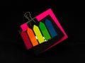 colorful sticky notes with paper clip on black background Royalty Free Stock Photo