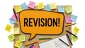 Colorful sticky notes surrounding a revision bubble on a desk Royalty Free Stock Photo