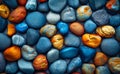 Colorful stones as background. Blue pebbles and colorful stones in a sea beach background Royalty Free Stock Photo