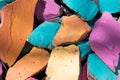 Colorful stones background. Bright colors of rocks. Blue, orange, pink color background Royalty Free Stock Photo