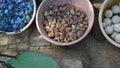 Colorful stones in clay vessels background Royalty Free Stock Photo