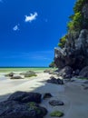 Colorful stones and white fine sand coral beach