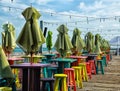 Colorful stools tables umbrellas on dark in Key West