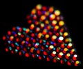 Colorful strass heart pattern on black