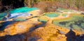 Colorful stratum of carbonic acid rock, tufa water