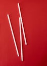 Colorful straw cocktail on a red background Royalty Free Stock Photo