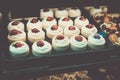 Colorful strawberry cakes selling in shop at Granville island public market