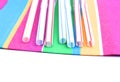 Colorful straws on colorful napkin. Plast and paper Royalty Free Stock Photo