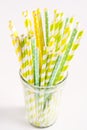 Colorful Straws Yellow and Green Straws in Glass White Background Vertical Royalty Free Stock Photo