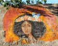 Colorful Street art graffiti mural of african black woman